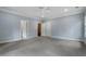 Spacious bedroom with gray carpeting and access to a bathroom at 1015 Nawench Dr, Atlanta, GA 30327