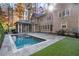 Inviting pool with stone patio and lush landscaping at 1015 Nawench Dr, Atlanta, GA 30327