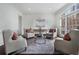 Sun-drenched sitting room featuring hardwood floors and ample natural light at 1015 Nawench Dr, Atlanta, GA 30327