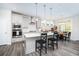 Open kitchen with island, stainless steel appliances, and breakfast area at 51 Riverbirch Way, Dallas, GA 30157