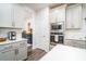 Modern kitchen with gray cabinets and stainless steel appliances at 51 Riverbirch Way, Dallas, GA 30157