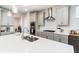 Modern kitchen with stainless steel appliances and white quartz countertops at 51 Riverbirch Way, Dallas, GA 30157
