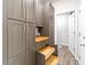 Gray cabinets and pull out drawers offer extra pantry storage at 51 Riverbirch Way, Dallas, GA 30157