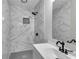 Modern bathroom with marble shower and gray vanity at 1625 Austin Dr, Decatur, GA 30032