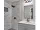 Updated bathroom with gray vanity and marble shower at 1625 Austin Dr, Decatur, GA 30032