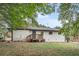 Back of house, white brick, wooden deck, grassy yard at 1625 Austin Dr, Decatur, GA 30032