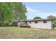 White brick house with a wooden deck and backyard at 1625 Austin Dr, Decatur, GA 30032