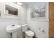 Clean bathroom with pedestal sink, toilet, and tiled shower/tub combo at 1284 Piedmont Ne Ave # 5, Atlanta, GA 30309