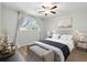 Cozy bedroom featuring a ceiling fan, neutral decor, and natural light from a window at 1284 Piedmont Ne Ave # 5, Atlanta, GA 30309