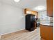 Bright kitchen with modern appliances, stone backsplash, and light wood cabinets at 1284 Piedmont Ne Ave # 5, Atlanta, GA 30309
