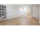 Spacious living area with light hardwood flooring, closet, and access to a patio at 1284 Piedmont Ne Ave # 5, Atlanta, GA 30309