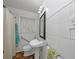 Tiled bathroom featuring a toilet, a sink, and a shower with a curtain at 1350 Ruth, Decatur, GA 30035