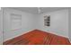 A small bedroom with hardwood floors and two windows at 1350 Ruth, Decatur, GA 30035
