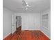 This bedroom has hardwood floors, window with blinds and three doors at 1350 Ruth, Decatur, GA 30035