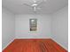 A simple bedroom featuring hardwood floors and natural light from a window at 1350 Ruth, Decatur, GA 30035