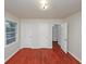 This bedroom has hardwood floors, three doors and a window at 1350 Ruth, Decatur, GA 30035
