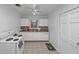 Bright kitchen featuring white appliances, cabinets, and tile flooring at 1350 Ruth, Decatur, GA 30035