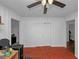 Living room with light walls, wood floors, a ceiling fan and a closet at 1350 Ruth, Decatur, GA 30035
