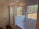 Bathroom with a shower and soaking tub, white tile at 372 Bloomfield Cir, Canton, GA 30114