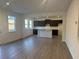 Open concept kitchen with island and dark cabinetry at 372 Bloomfield Cir, Canton, GA 30114