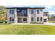 Stunning exterior view of a modern home with brick facade, contrasting dark siding, and lush green lawn at 555 Versailles Dr, Auburn, GA 30011