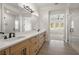 Modern bathroom boasts double sinks and a walk-in shower at 2760 Marie Way, Cumming, GA 30028