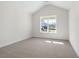 Spacious bedroom with large window and carpet flooring at 2760 Marie Way, Cumming, GA 30028