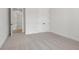 Bright bedroom with carpet and access to another room at 2760 Marie Way, Cumming, GA 30028