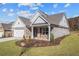 Brick home with craftsman style, 2-car garage, and landscaped yard at 2760 Marie Way, Cumming, GA 30028
