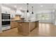 Modern kitchen with island and stainless steel appliances at 2760 Marie Way, Cumming, GA 30028