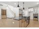 Modern kitchen with island, stainless steel appliances, and light wood cabinets at 2760 Marie Way, Cumming, GA 30028