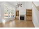 Spacious living room with fireplace and built-in shelving at 2760 Marie Way, Cumming, GA 30028