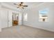 Main bedroom with ceiling fan and access to en suite bathroom at 2760 Marie Way, Cumming, GA 30028