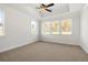 Large main bedroom with ceiling fan and neutral carpeting at 2760 Marie Way, Cumming, GA 30028