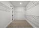 Large walk-in closet with ample shelving at 2760 Marie Way, Cumming, GA 30028