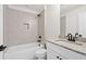 Modern bathroom with a shower/tub combo, granite vanity, and neutral tile at 2780 Marie Way, Cumming, GA 30028