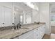 Bathroom with double vanity, granite countertop and large mirror at 2780 Marie Way, Cumming, GA 30028