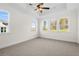 Spacious bedroom with ceiling fan and neutral carpeting at 2780 Marie Way, Cumming, GA 30028