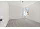 Bright bedroom with grey carpet and neutral walls at 2780 Marie Way, Cumming, GA 30028
