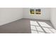 Bright bedroom with grey carpet and a large window at 2780 Marie Way, Cumming, GA 30028