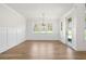 Bright dining room with hardwood floors and wainscoting at 2780 Marie Way, Cumming, GA 30028