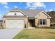 Two-car garage and front door entryway at 2780 Marie Way, Cumming, GA 30028