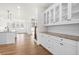 Open concept kitchen with white cabinets and granite countertops at 2780 Marie Way, Cumming, GA 30028