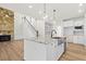 Open concept kitchen and Gathering room with stone fireplace and kitchen island at 2780 Marie Way, Cumming, GA 30028