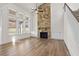Open living room with high ceilings and stone fireplace at 2780 Marie Way, Cumming, GA 30028