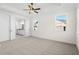 Bright bedroom with ensuite bathroom access and neutral carpeting at 2780 Marie Way, Cumming, GA 30028