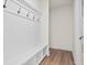 Mudroom with white bench, cubbies, and hooks at 2780 Marie Way, Cumming, GA 30028