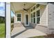 Covered back patio with ceiling fan, and multiple windows at 2735 Marie Way, Cumming, GA 30028