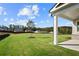 Large backyard with grassy lawn and covered patio at 2735 Marie Way, Cumming, GA 30028