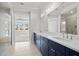Elegant bathroom with double vanity, walk-in shower, and bedroom view at 2735 Marie Way, Cumming, GA 30028